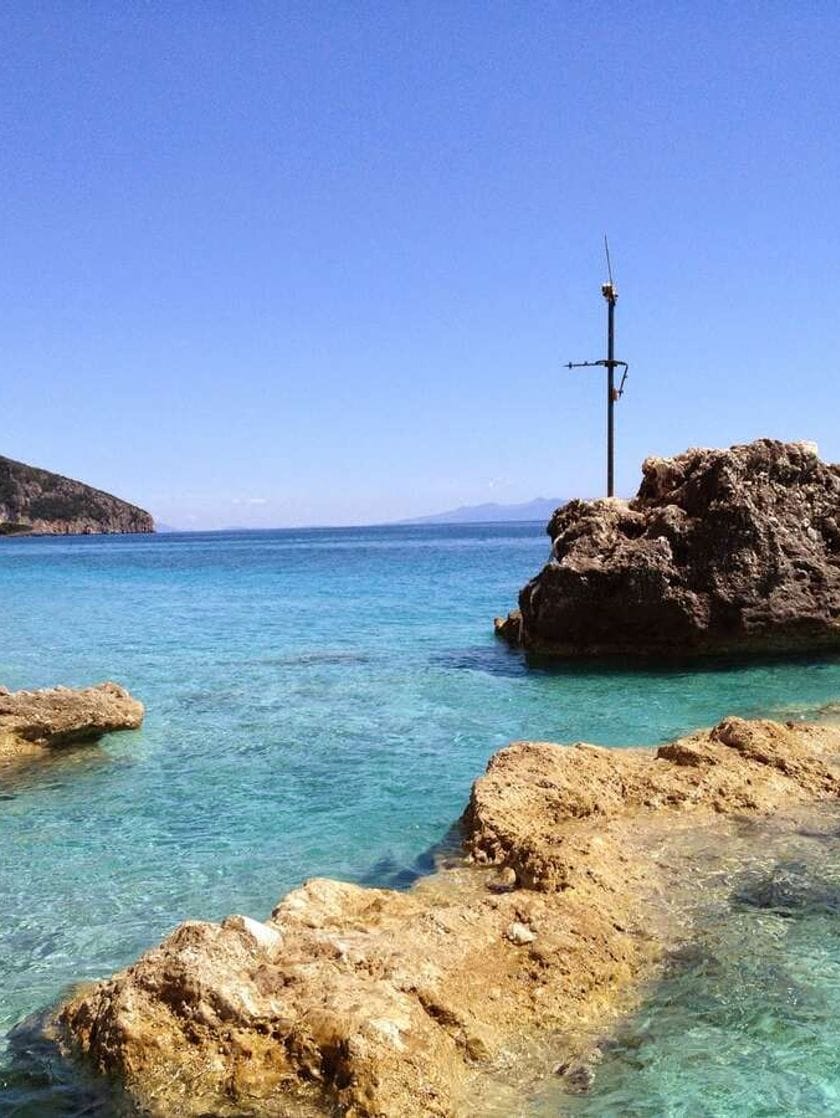 Clear azure water and rocky outcroppings.