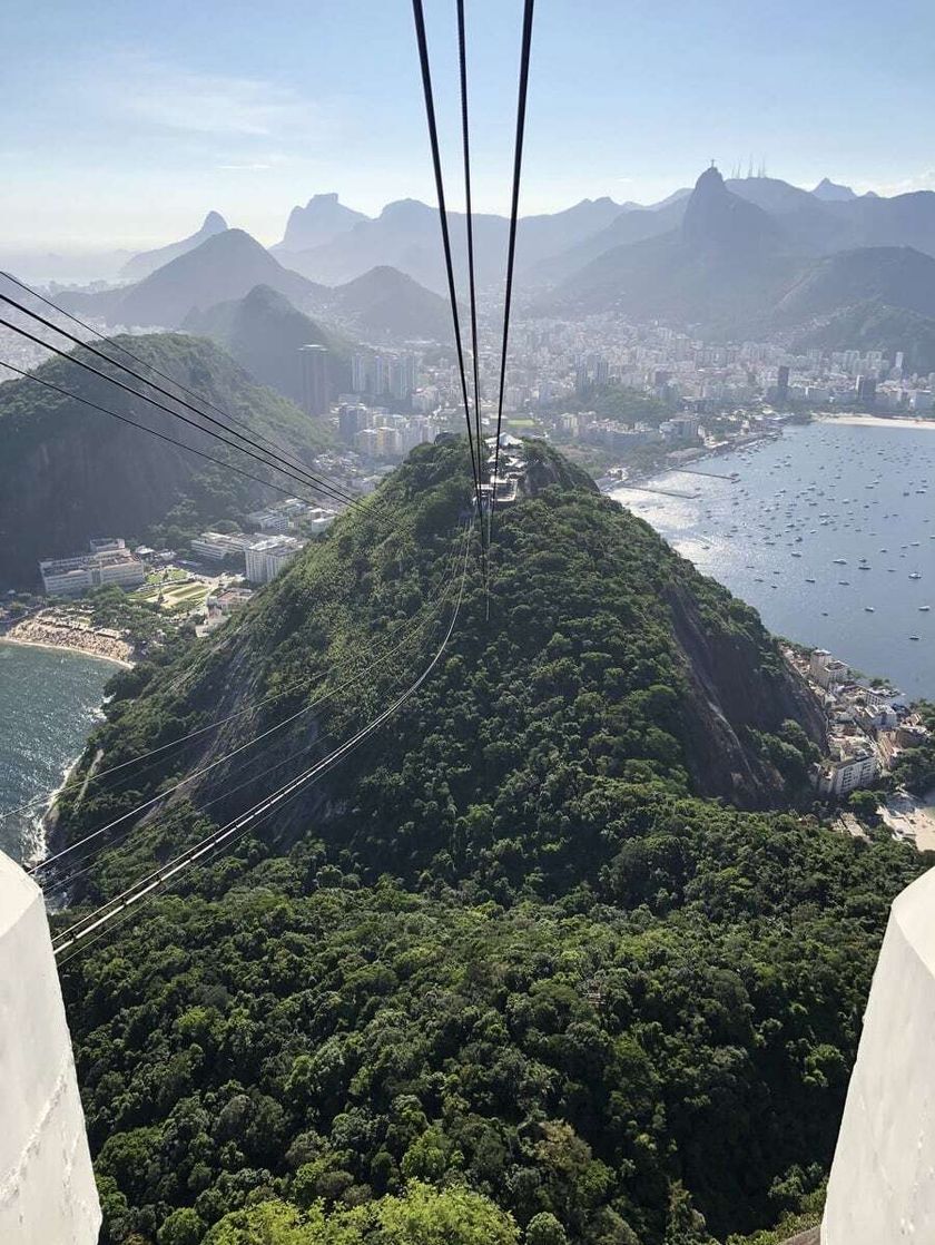 Cables running across the skyline to Sugarloaf mountain, with the city and other peaks in the distance.
