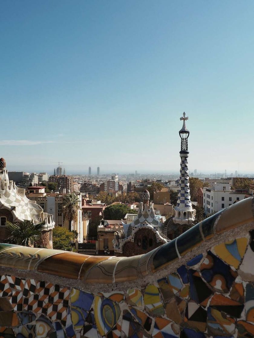 The colourful tiled rooftops, highrise buildings and palm trees of Barcelona.